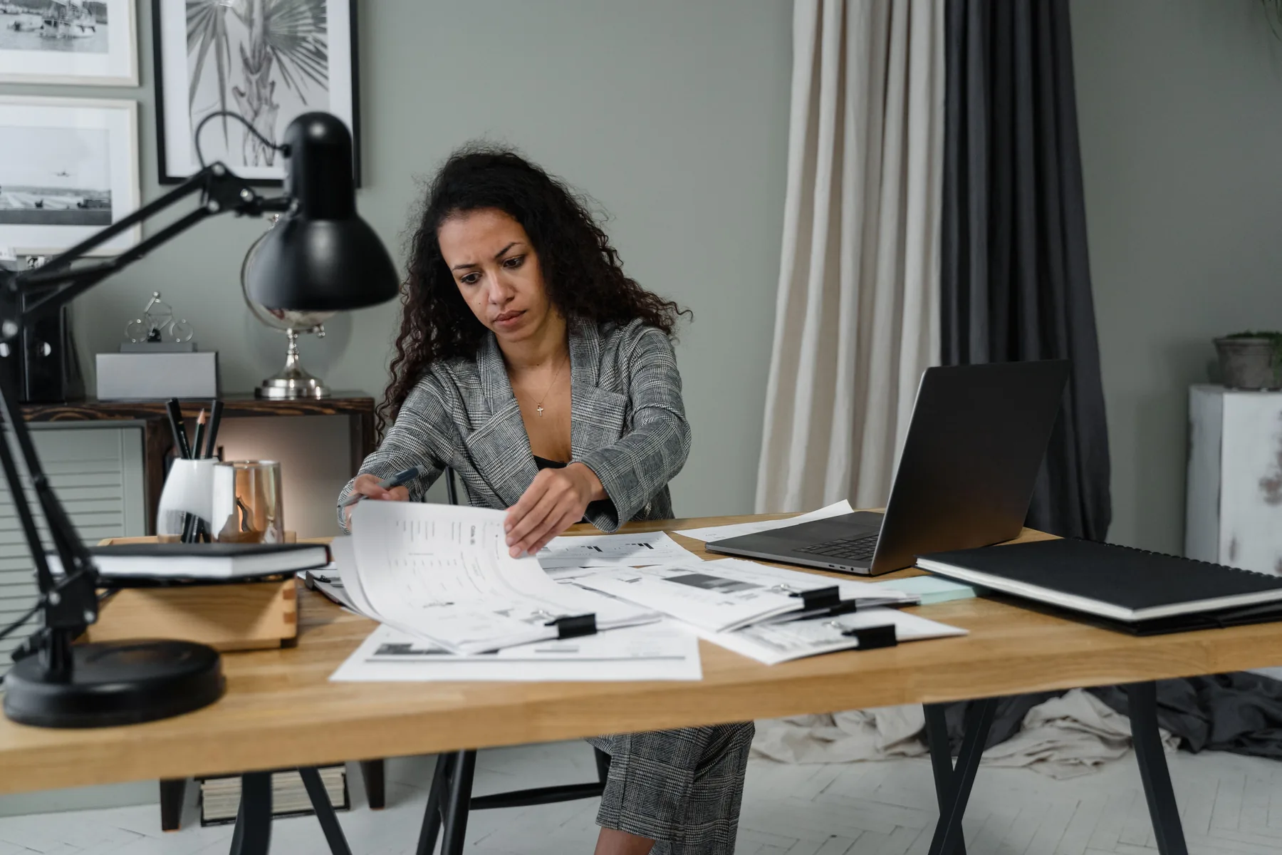Executive reviewing documents at a desk