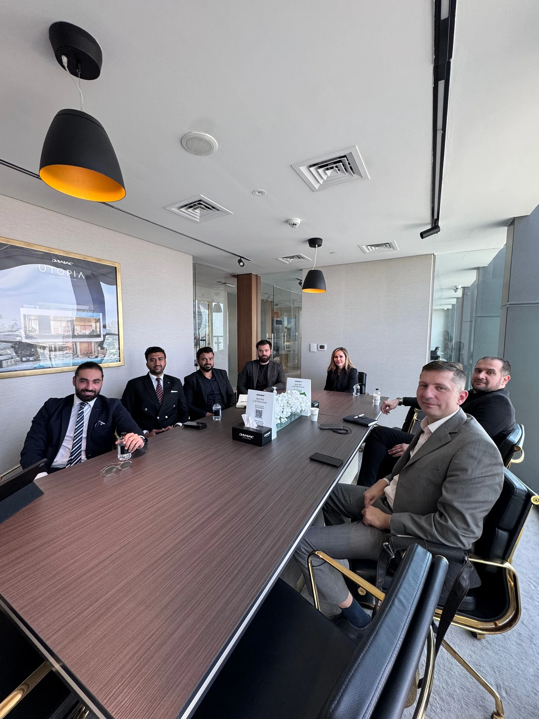 Executive team in a formal conference-room meeting